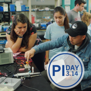 Three students working in a lab.