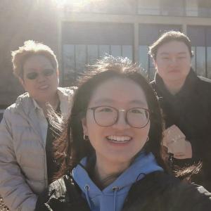 three people standing outside