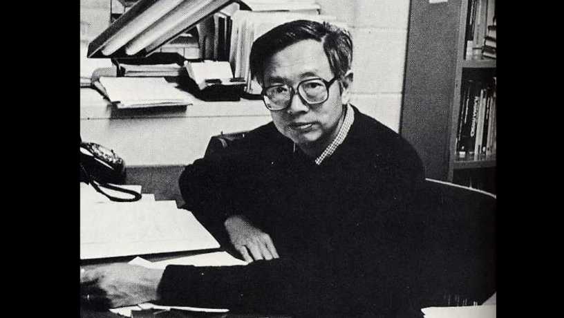 Photo of Prof. C.K. Chu sitting at his desk in 1983
