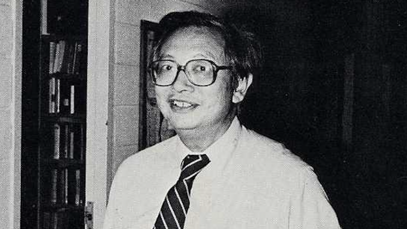 Photo of Prof. C.K. Chu standing in his office in 1984