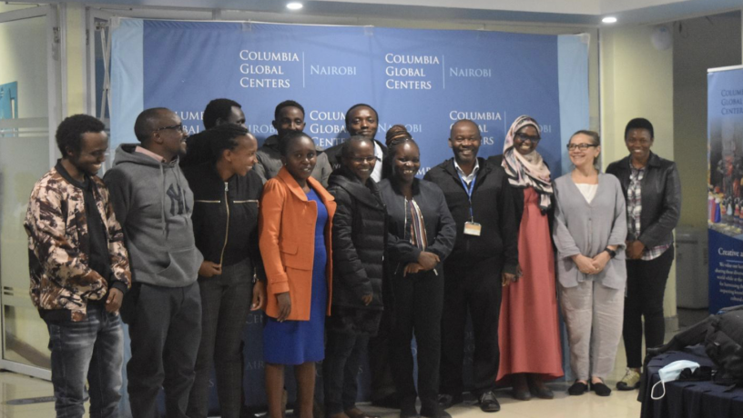 A group photo of the conference participants and organizers. 14 people are featured in this photo.