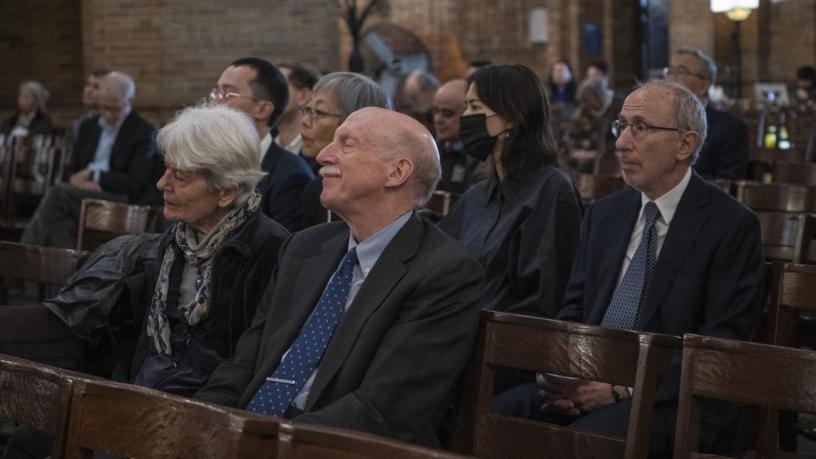 People sitting the chapel and listening to talks.