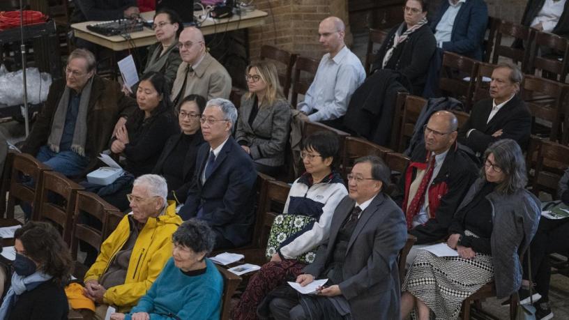 People sitting in a chapel