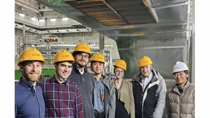a group of people standing in a lab