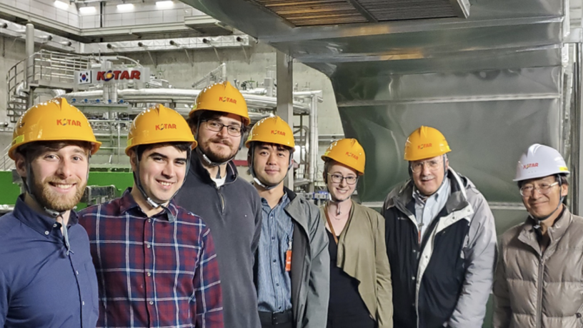 a group of students and faculty in a lab