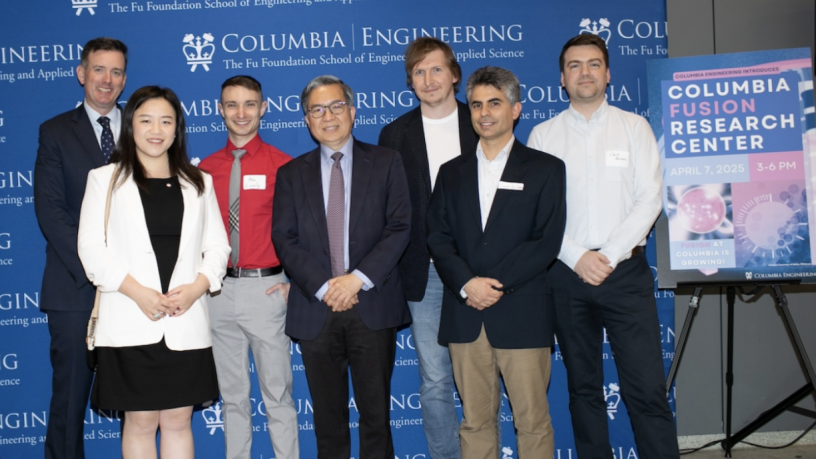 a photo of people standing in front of a the Columbia Engineering logo