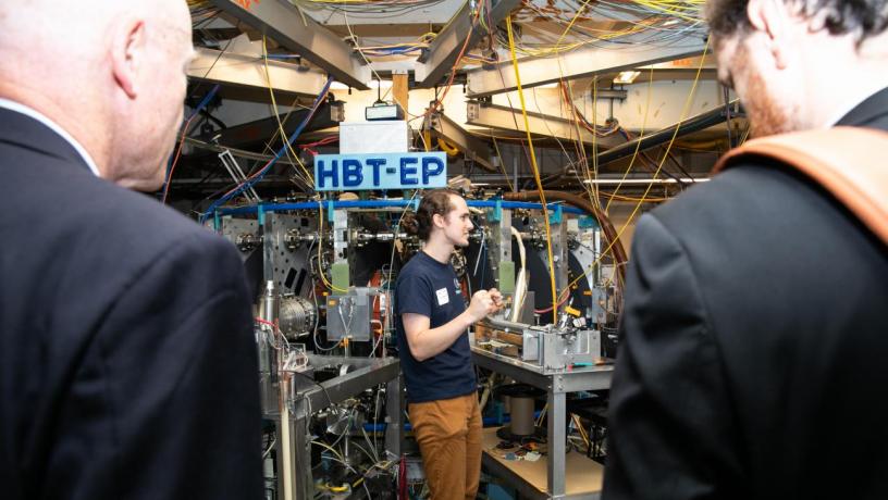 a student leading a lab tour of the HBT-EP experiment