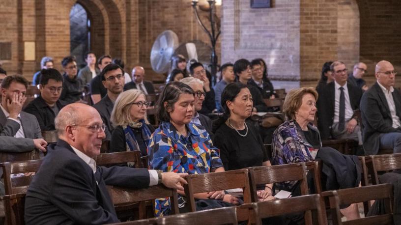 people sitting in a chapel