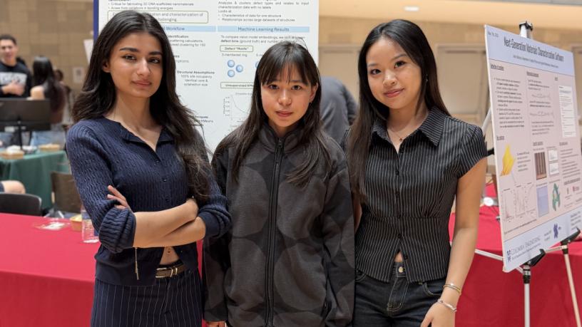 students standing in front of a poster