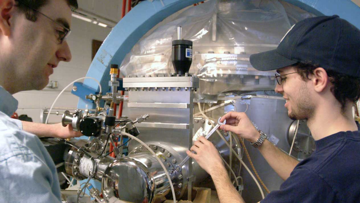 Student with a faculty member in a lab