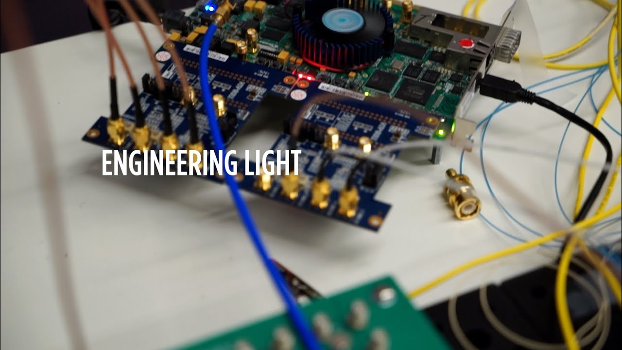A nanophotonics circuit board labeled “Engineering Light"
