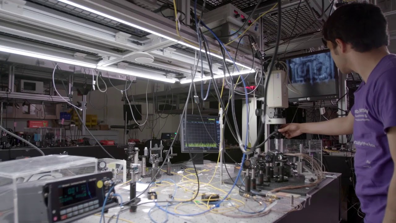 A lab with optical equipment and cables.