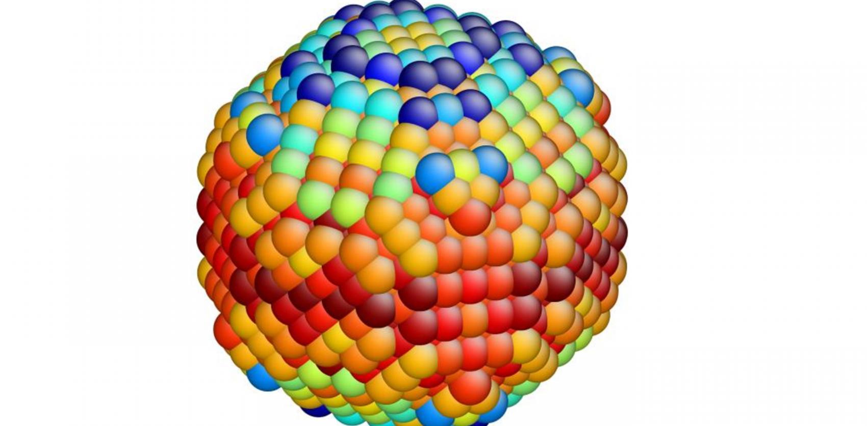 Three-dimensional rendering of a spherical structure made up of tightly packed, multicolored spheres arranged in a repeating pattern.
