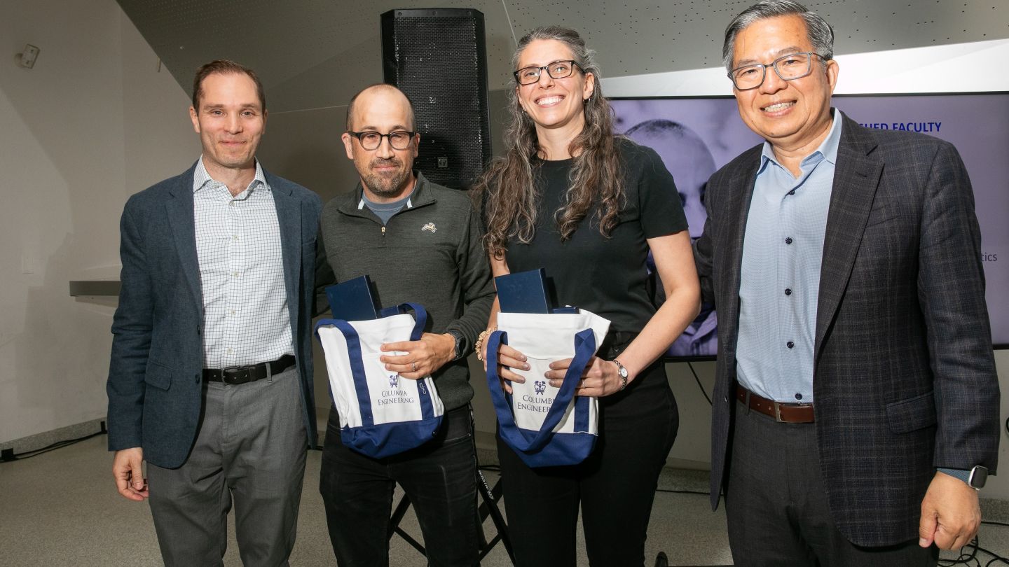 Lauren Marbella and Drew Youngren hold tote bags as they pose with Alexander Potulicki and Dean Shih-Fu Chang.