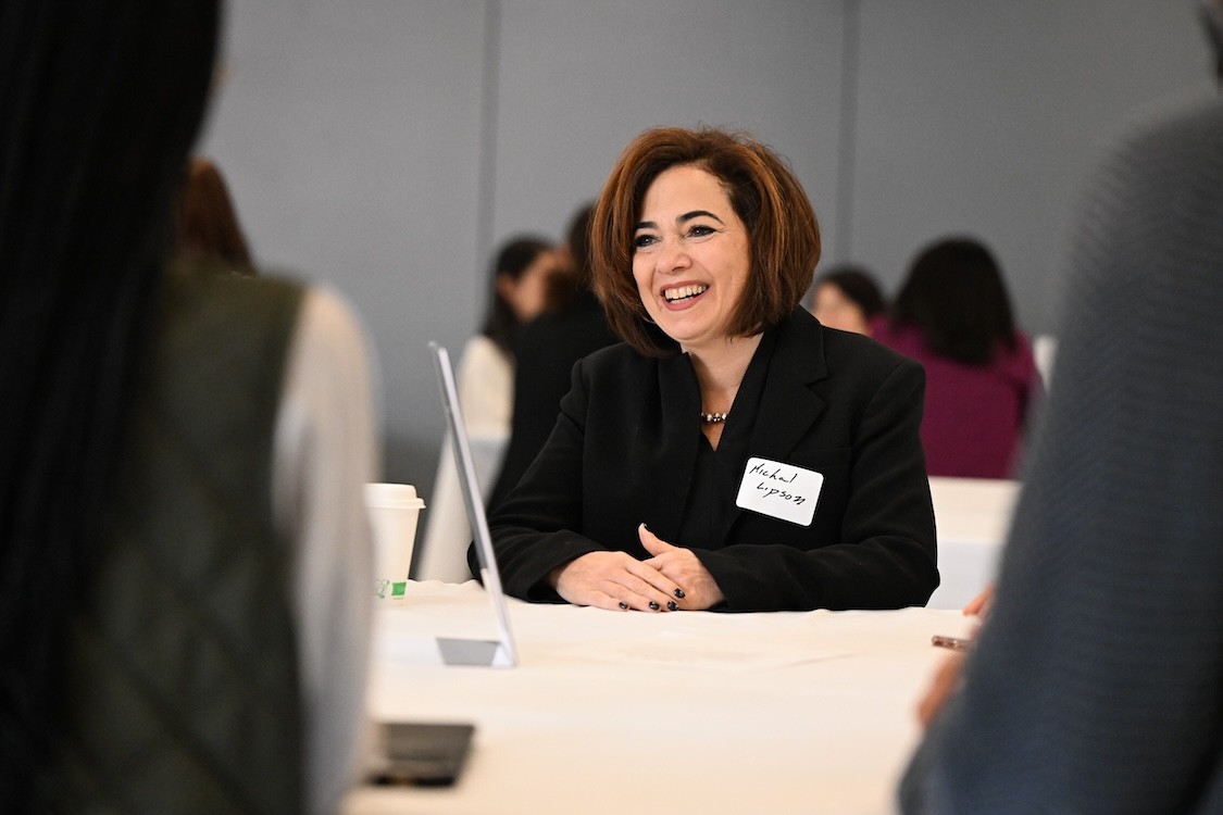 Michal Lipson among a crowded room at a Women in STEM networking event